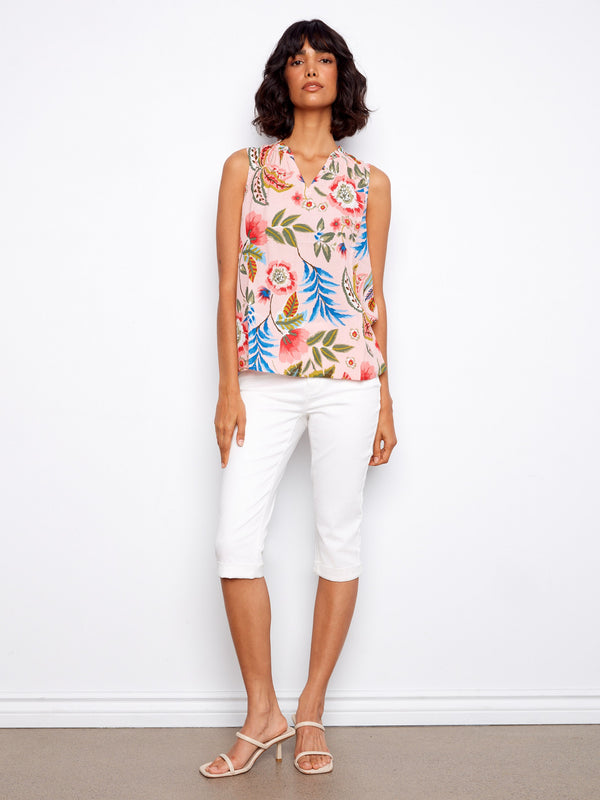 Experience the comfort of this sleeveless floral top, perfect for warm days by Charlie B.