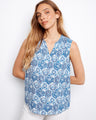 Elegant top with a V-neck, featuring a beautiful blue pattern and sleeveless design for a chic summer look by Charlie B.