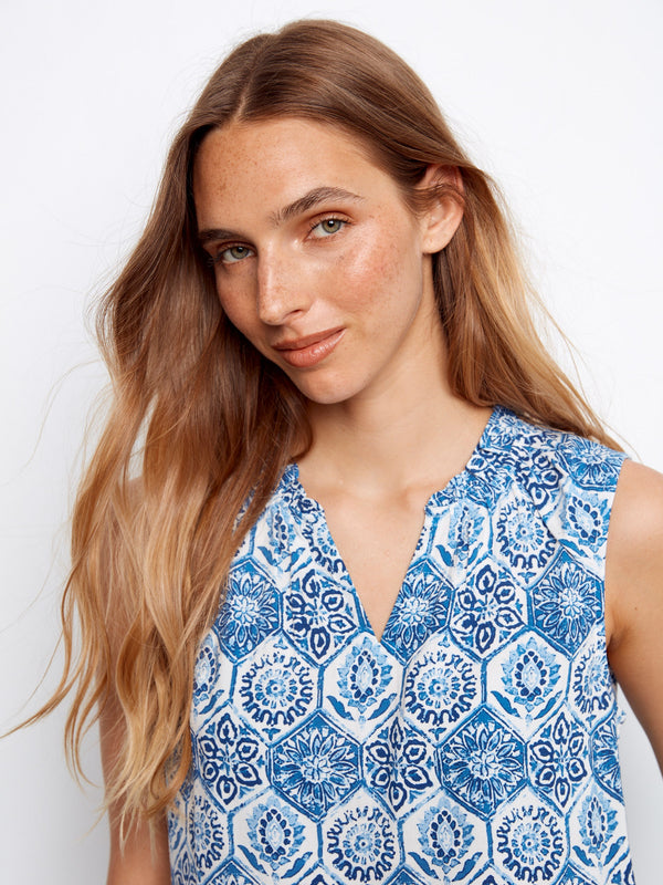 Charming sleeveless design in this patterned top ensures comfort and style for warm days, designed by Charlie B.