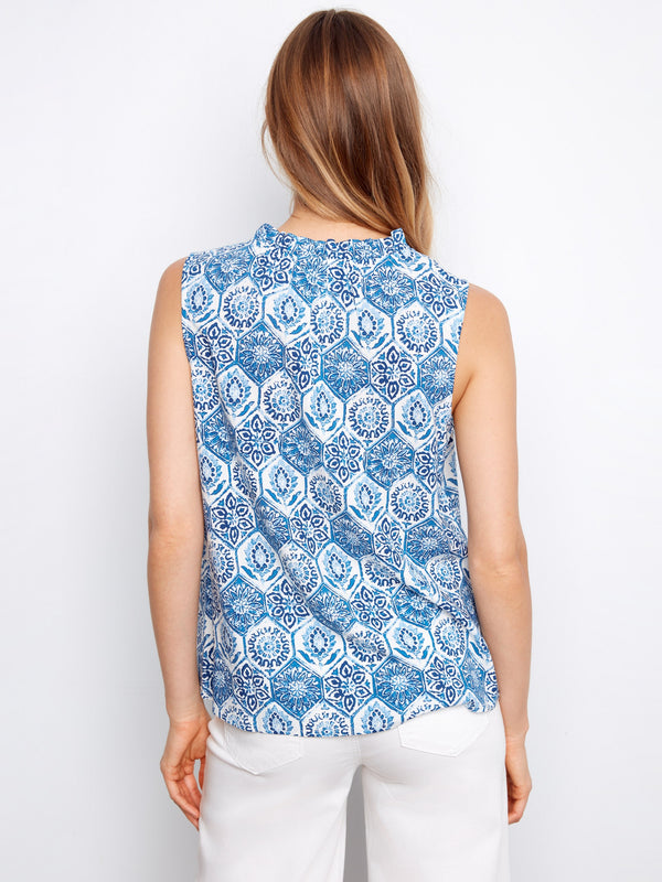 This V-neck top combines comfort and style with its striking pattern and sleeveless cut, exclusively from Charlie B.