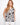 This top features an elegant V-neck design with a black and white floral pattern, perfect for a chic summer look by Charlie B.