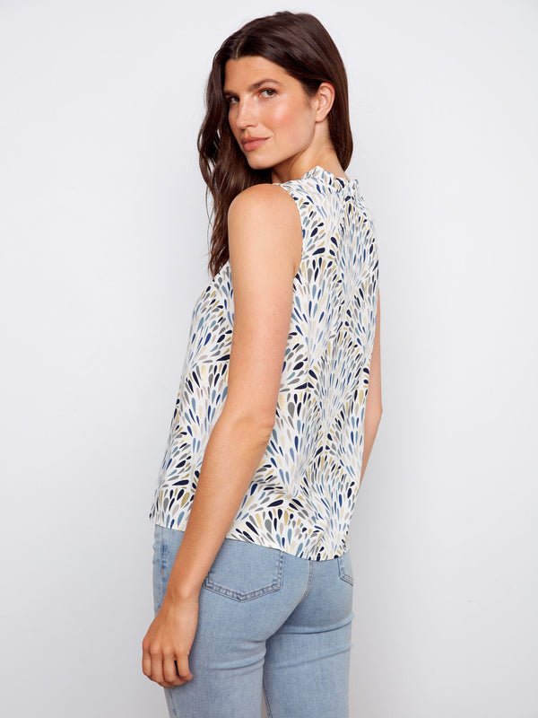 Lightweight top with ruffled neckline and gardenia floral pattern, offering a chic look by Charlie B.