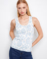 The top features a scoop neckline, enhancing its elegant design with a floral pattern. Perfect for casual outings. By Charlie B.