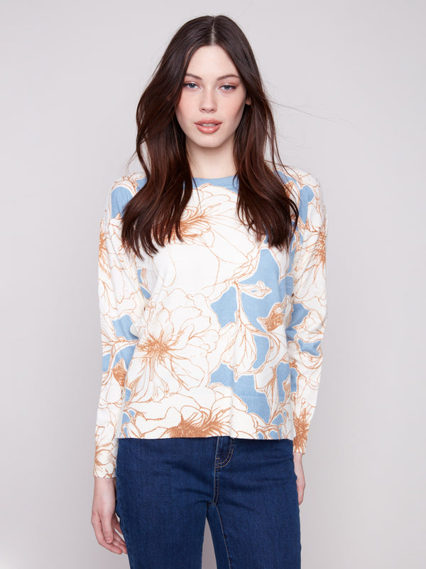 Sweater featuring a floral mist design with a classic crew neck by Charlie B.