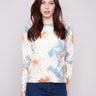 Sweater featuring a floral mist design with a classic crew neck by Charlie B.