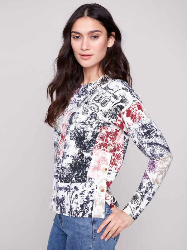 Sweater featuring a crew neck with an abstract Frame print and stylish side buttons by Charlie B.