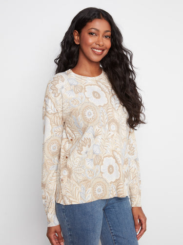 Soft and comfortable sweater adorned with intricate floral patterns, ideal for everyday wear. Created by Charlie B.