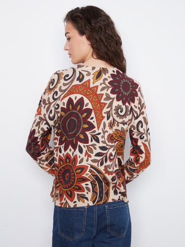 A vibrant floral design covers the entire sweater, making it a standout piece for your wardrobe essentials by Charlie B.