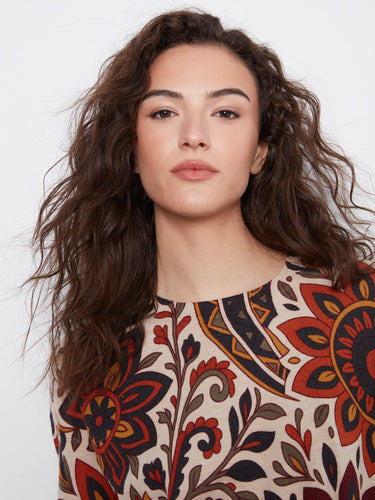 Side buttons accentuate the chic style of this stunning floral patterned top, making it a versatile addition to your collection by Charlie B.