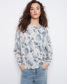 Floral top with a classic crew neck, showcasing an elegant design perfect for casual outings. By Charlie B.