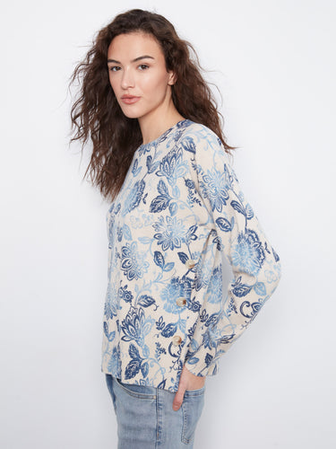Stylish floral top featuring side buttons, adding a unique touch to the overall design. By Charlie B.