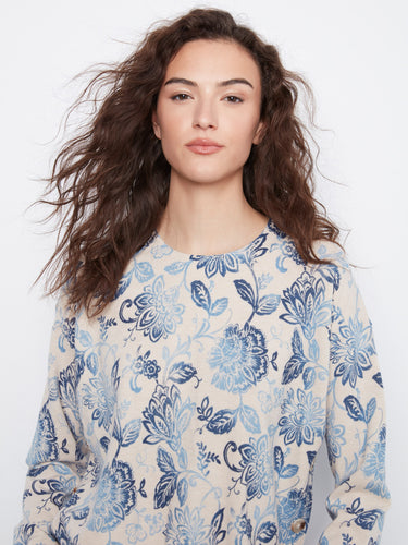 Chic floral-patterned top with intricate detailing for a sophisticated look on any occasion. By Charlie B.