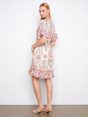 Stylish dress with an eye-catching V-neck and unique abstract prints, perfect for any occasion by Charlie B.