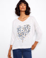White V-neck top with a charming placement print design and 3/4 sleeves, perfect for casual outings by Charlie B.