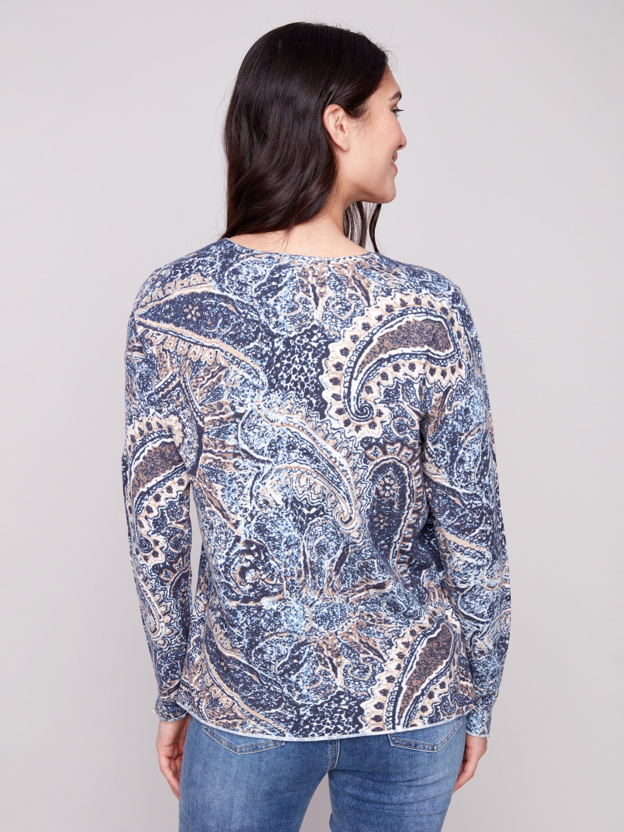 Sweater crafted with a plushy yarn texture and intricate paisley pattern, featuring side slits at cuffs and hem by Charlie B.