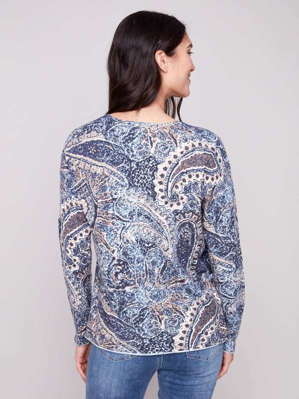 Sweater crafted with a plushy yarn texture and intricate paisley pattern, featuring side slits at cuffs and hem by Charlie B.