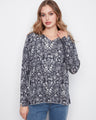 Floral top with a graceful V-neck, perfect for casual outings. The long sleeves add elegance to any look. By Charlie B.