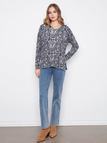 Relaxed fit floral top designed for comfort and style, featuring side slits at the cuffs and hem. A versatile piece by Charlie B.
