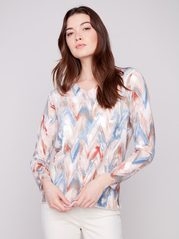 Sweater in a relaxed fit with a plushy yarn texture and colorful chevron pattern, perfect for cozy days by Charlie B.