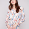 Sweater in a relaxed fit with a plushy yarn texture and colorful chevron pattern, perfect for cozy days by Charlie B.
