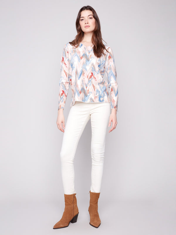 Chevron patterned sweater with long sleeves offers both style and warmth in plushy yarn fabric by Charlie B.
