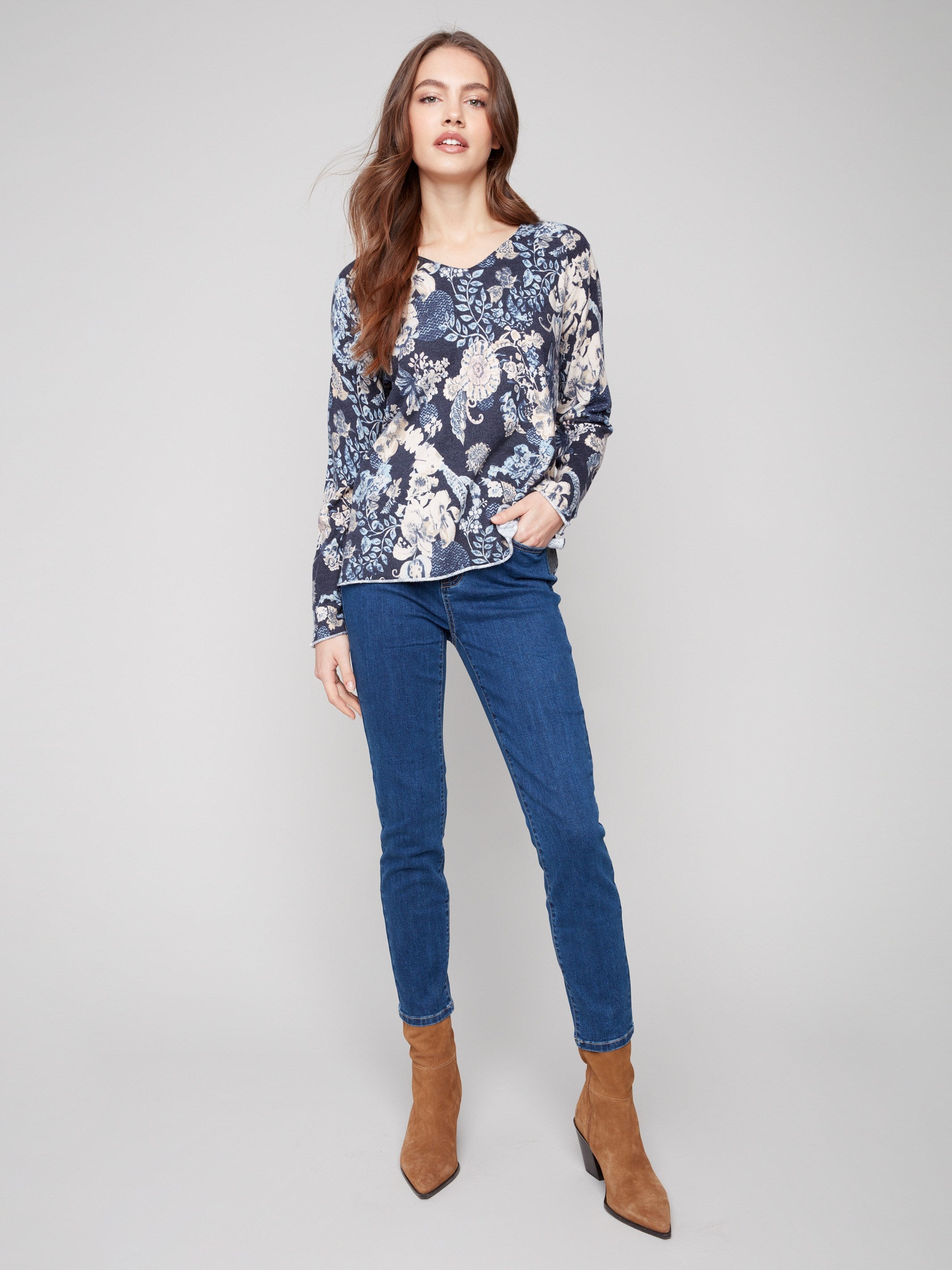 Sweater with a plushy yarn texture and colorful floral pattern, showcasing a relaxed fit for comfort by Charlie B.