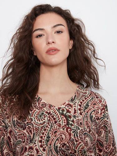 The side slits at cuffs and hem add a chic touch to this paisley patterned top by Charlie B.