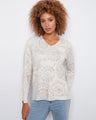 V-neck sweater with long sleeves and side slits at cuffs, featuring abstract print in neutral tones by Charlie B.