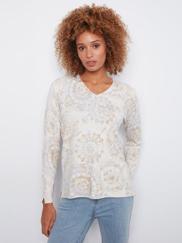 V-neck sweater with long sleeves and side slits at cuffs, featuring abstract print in neutral tones by Charlie B.
