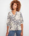 Floral blouse featuring a stand collar and elegant pattern, perfect for casual outings or office wear. By Charlie B.