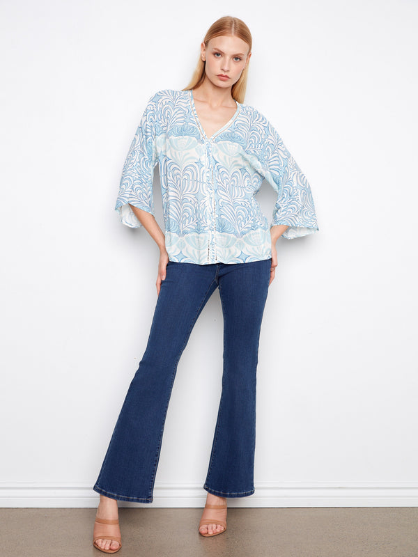 This piece boasts wide 3/4 sleeves, offering both comfort and style for any occasion by Charlie B.