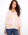 Chic top showcasing a V-neck design, perfect for casual outings. The subtle pattern adds elegance to any look by Charlie B.