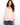 Chic top showcasing a V-neck design, perfect for casual outings. The subtle pattern adds elegance to any look by Charlie B.