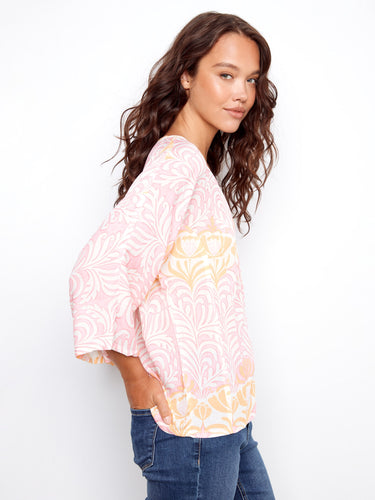 This stylish piece features wide 3/4 sleeves, offering comfort and flair in one garment by Charlie B.