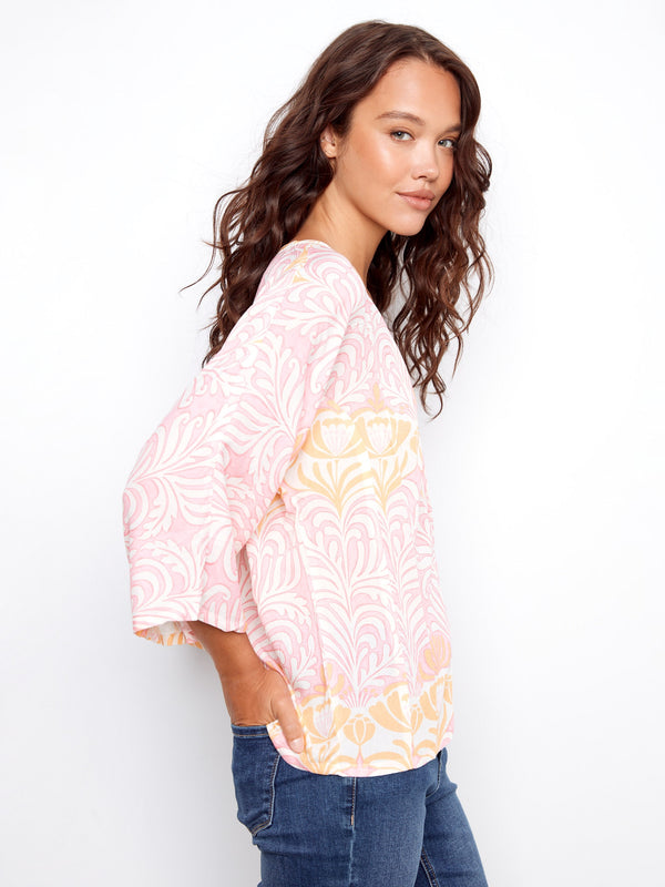 This stylish piece features wide 3/4 sleeves, offering comfort and flair in one garment by Charlie B.