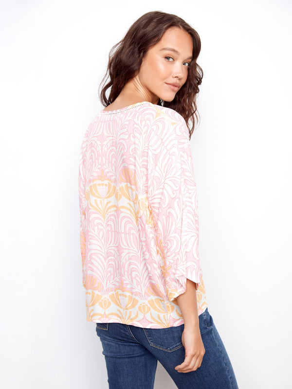 Wide 3/4 sleeves provide comfort and style in this delightful patterned top, suitable for everyday wear. By Charlie B.