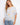Striped dolman top featuring a boat neckline and sunny embroidery, crafted from lightweight fabric by Charlie B.
