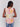 Vibrant sleeveless design featuring geometric accents by Charlie B.