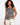 This sleeveless design top features a striking pattern, perfect for warm weather styling. The relaxed fit adds comfort. By Charlie B.