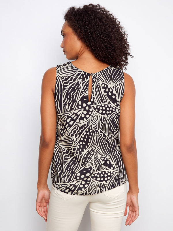 The keyhole back detail adds a touch of elegance to this patterned sleeveless top, making it suitable for both casual and formal settings. By Charlie B.