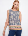 Blue sleeveless top with a striking pattern and crew neckline, accented by a detailed border design for added flair by Charlie B.