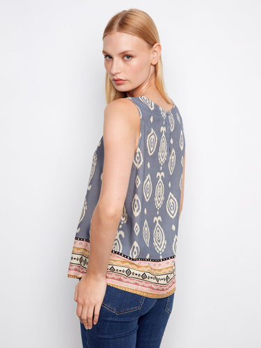 Stylish blue graphic print top with keyhole back detail, complete with an artistic border design for visual interest by Charlie B.