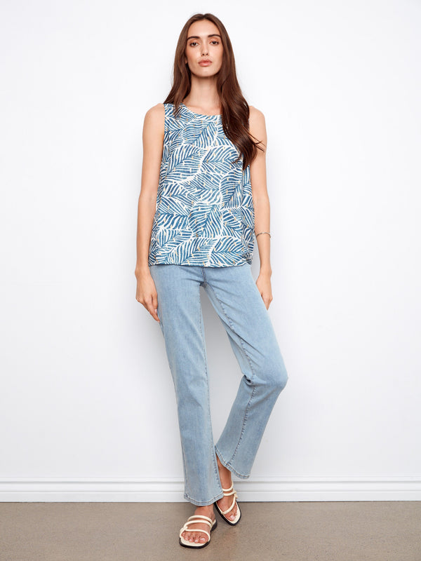 The lightweight fabric and bold print make this top a must-have addition to your summer wardrobe collection by Charlie B.