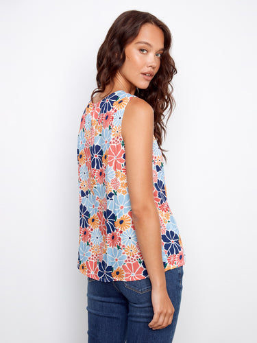 Stylish floral blouse showcasing an elegant crew neckline and playful pattern, perfect for casual wear. By Charlie B.