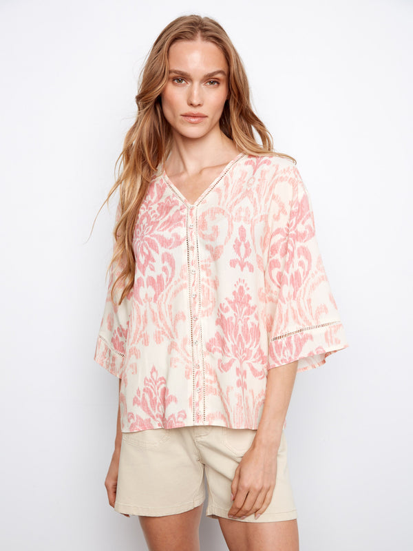 Blouse with wide elbow sleeves and abstract pink and white pattern, featuring a relaxed fit by Charlie B.