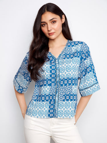 Enjoy the relaxed fit of this versatile top, offering both comfort and style for everyday wear or special events by Charlie B.