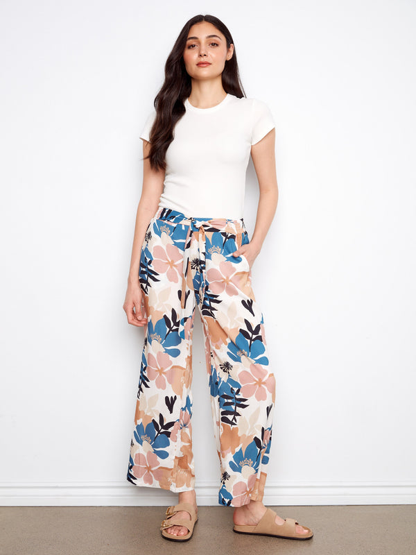 Floral pants featuring a self belt tie, perfect for adding a touch of elegance to any outfit. Designed by Charlie B.