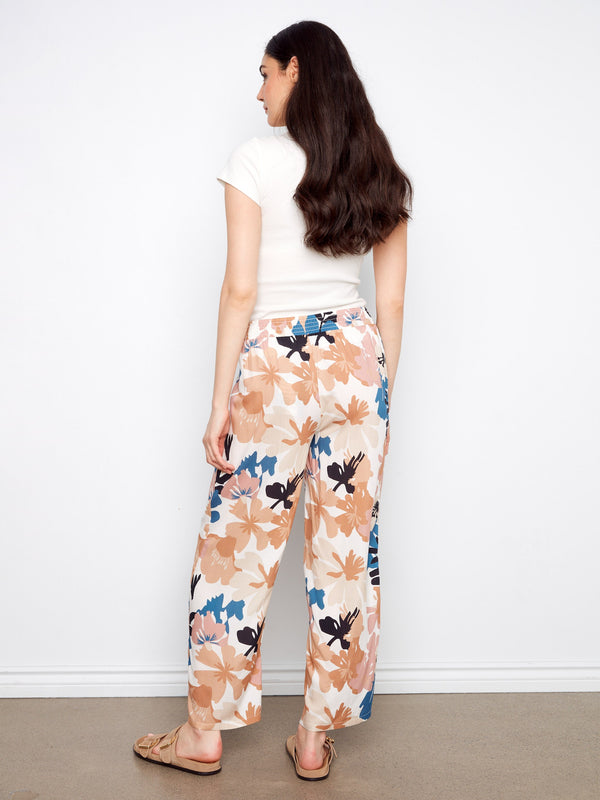 Designed with a regular rise, these wide-leg pants offer comfort and style in one beautiful package. By Charlie B.
