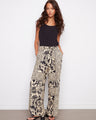 Stylish pants featuring a wide leg design with a chic self-tie belt for added elegance by Charlie B.