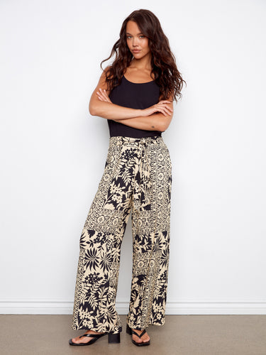 Designed with convenient slash pockets, these pants offer both functionality and style by Charlie B.